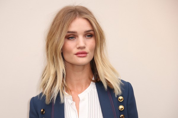 Model Rosie Huntington-Whiteley poses for photographers upon arrival at the Autumn Winter 2016 Burberry Prorsum show in London, Monday, Feb. 22, 2016. (Photo by Joel Ryan/Invision/AP)