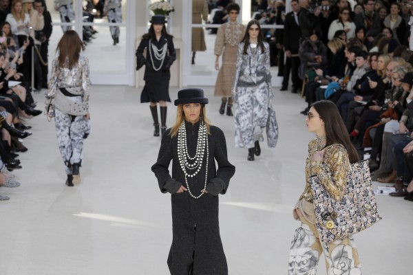 Models wear creations as part of Chanel's Fall-winter 2016-2017 ready to wear collection presented in Paris, France, Tuesday, March 8, 2016. (AP Photo/Francois Mori)