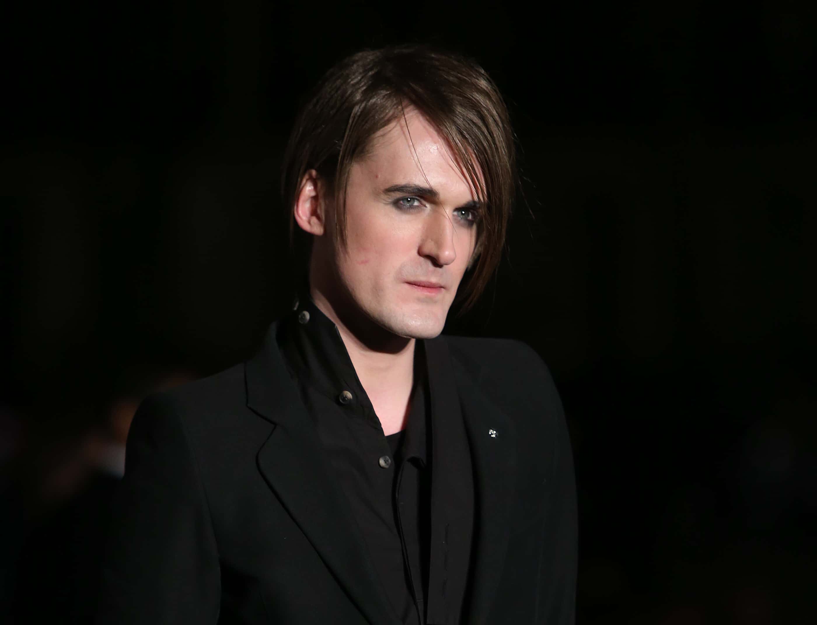 Gareth Pugh poses for photographers upon arrival at the Alexander McQueen Savage Beauty Gala exhibition in London, Thursday, March 12, 2015. (Photo by Joel Ryan/Invision/AP)