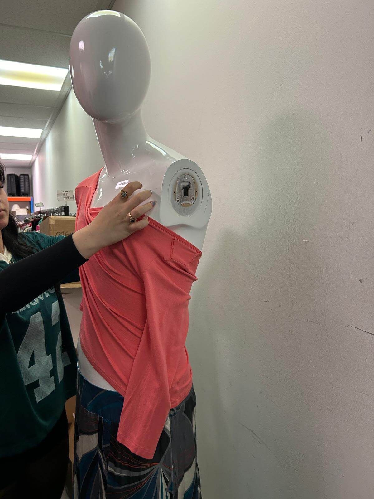 manipulating a long sleeve top 