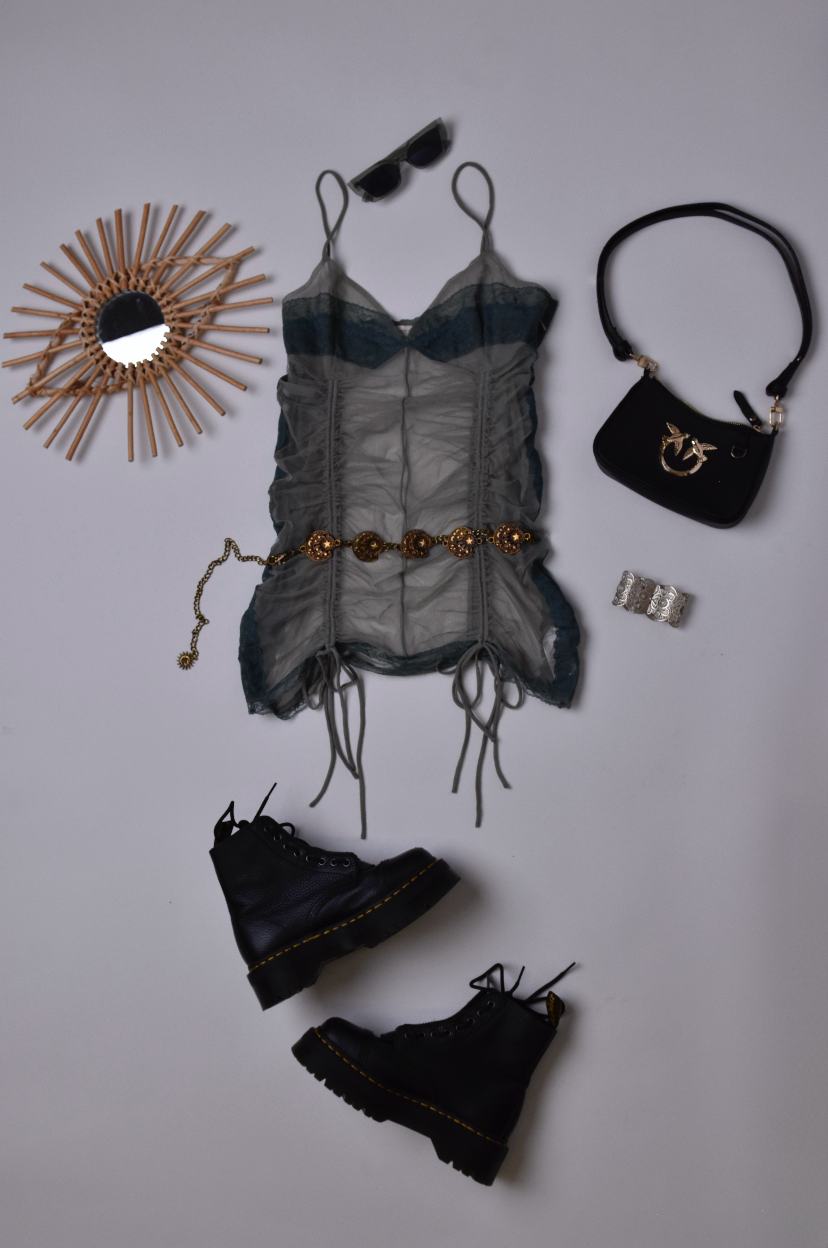 Festival outfit including mesh lace dress, Doc Marten boots, handbag, sunglasses and belt.